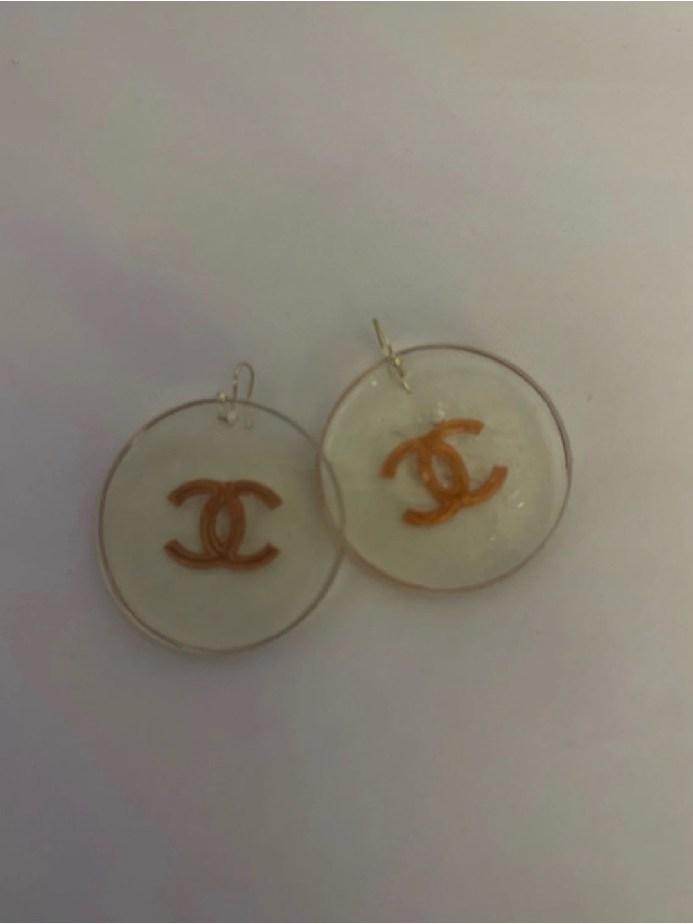 Round White Drop Earrings with Gold Logo Accent